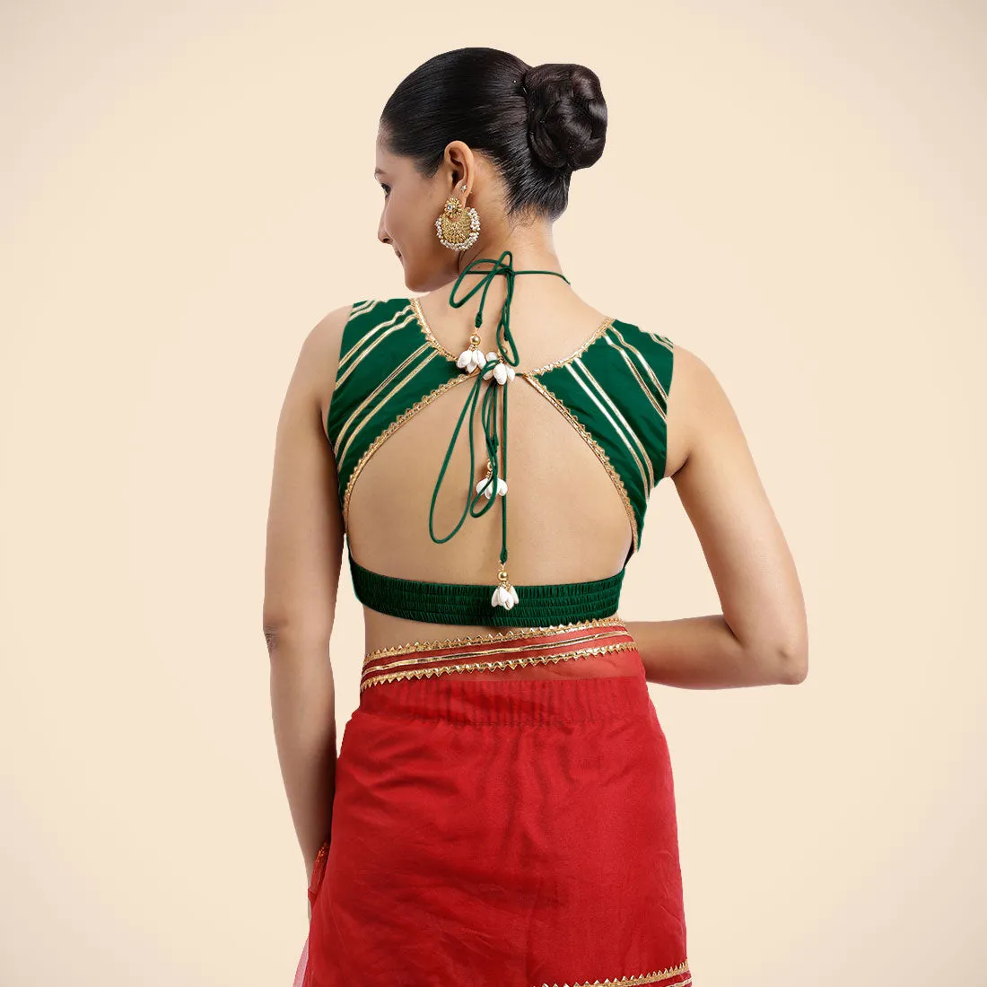 Ahana x Tyohaar | Bottle Green Sleeveless FlexiFit™ Saree Blouse with Plunging Neckline and Back Cut Out with Tasteful Golden Gota Lace Embellishment