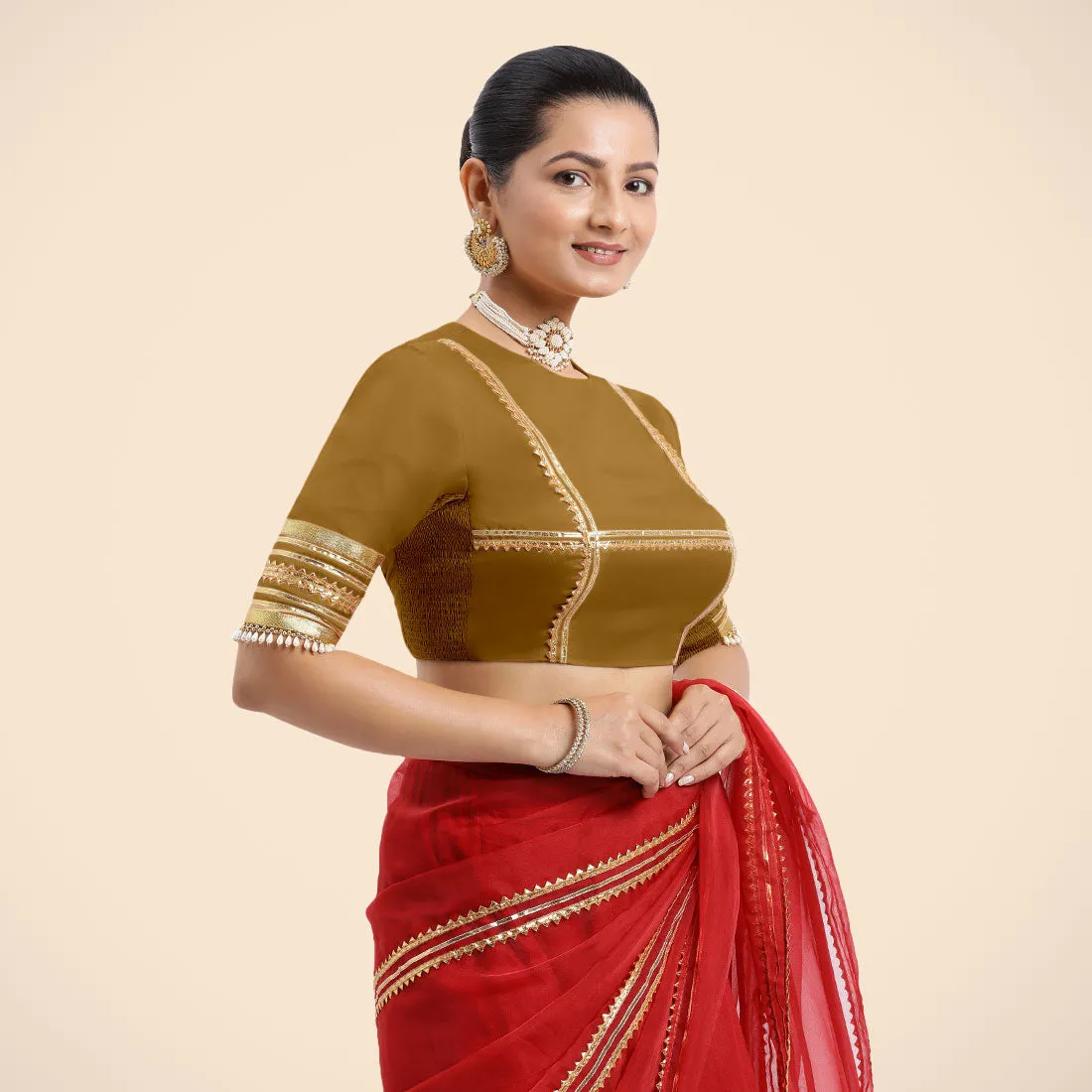 Farheen x Tyohaar | Bronze Gold Embellished Elbow Sleeves FlexiFit™ Saree Blouse with Zero Neck with Back Cut-Out and Golden Gota Embellishment