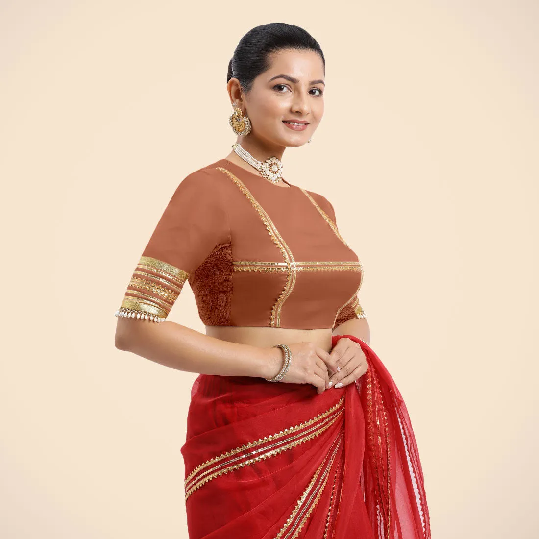 Farheen x Tyohaar | Metallic Copper Embellished Elbow Sleeves FlexiFit™ Saree Blouse with Zero Neck with Back Cut-Out and Golden Gota Embellishment